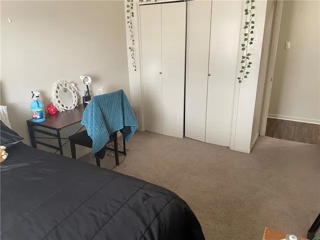 a bedroom with furniture and a window