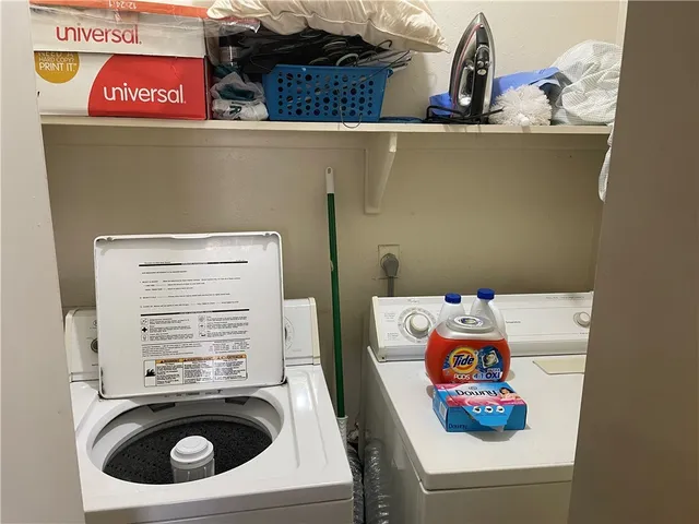 a utility room with dryer and washer