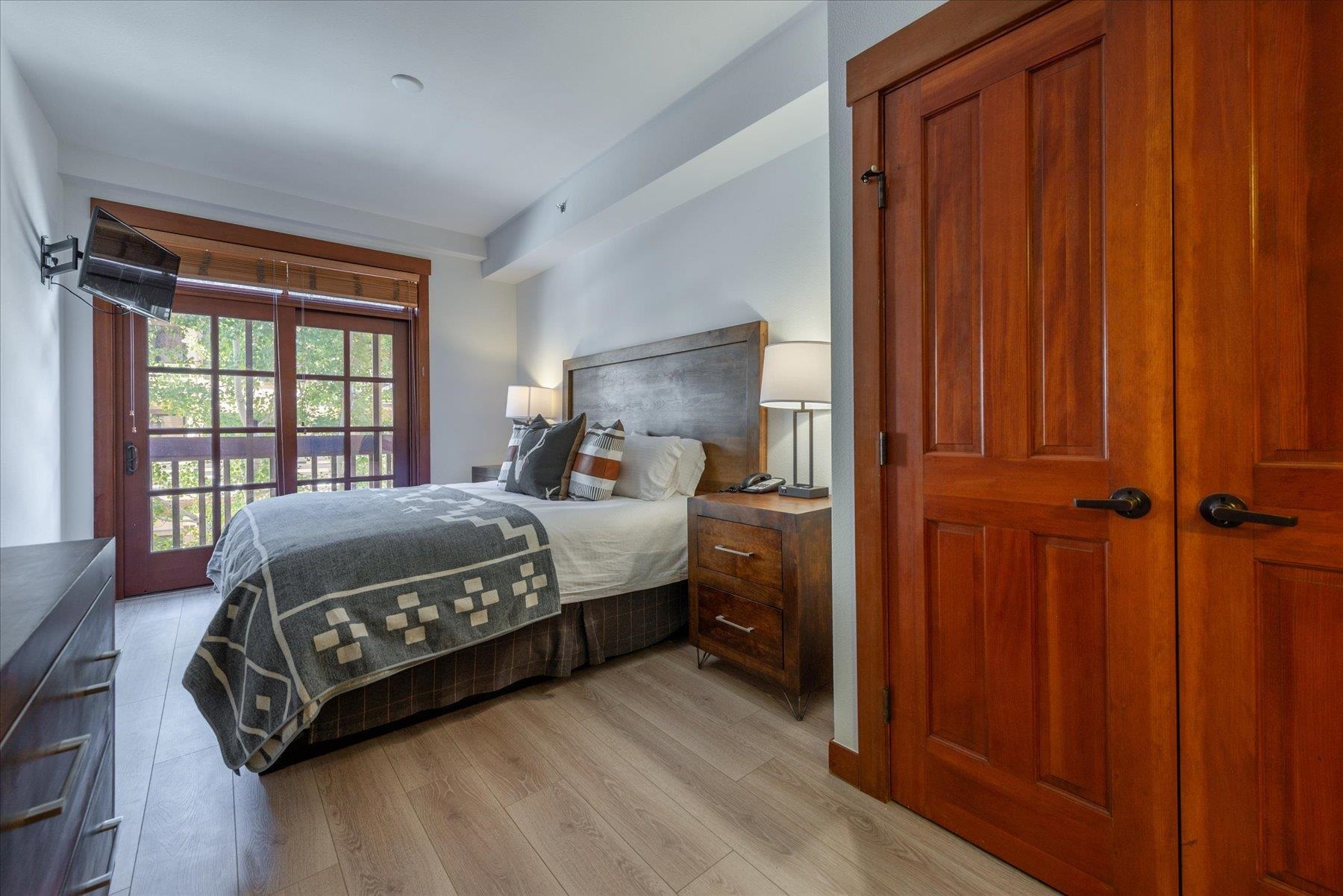 1850 Village South Road, Unit 4213 Olympic Valley, CA 96146 - Photo 11 of 17 a bedroom with a bed cabinet and a window