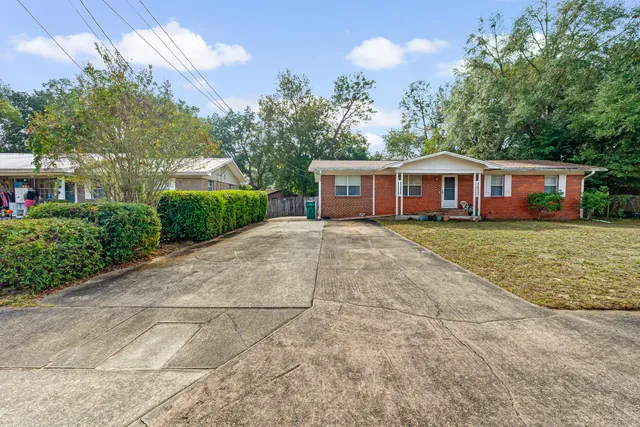 a view of outdoor space with deck and yard