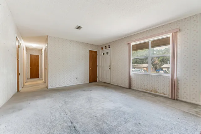 an empty room with windows