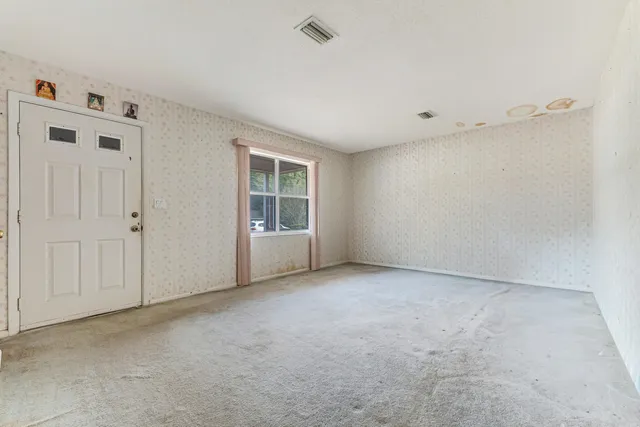 a kitchen with stainless steel appliances granite countertop a sink dishwasher stove and cabinets