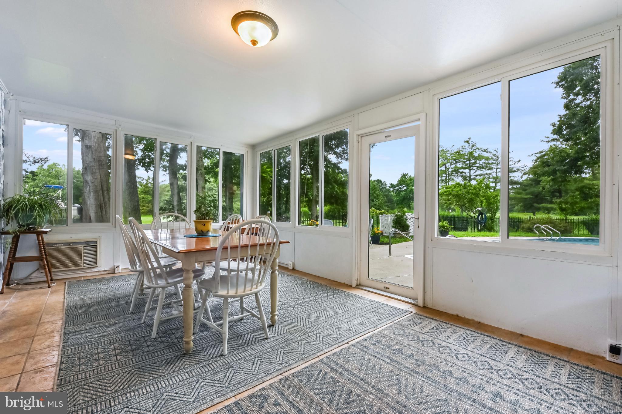 26698 Arcadia Shores Road Easton, MD 21601 - Photo 20 of 71 Bright sunroom with scenic outdoor views.