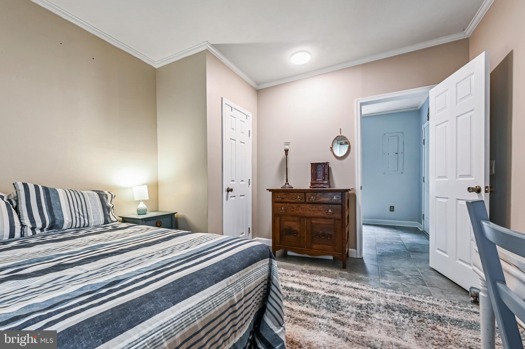 26698 Arcadia Shores Road Easton, MD 21601 - Photo 24 of 71 a bedroom with a bed and a dresser