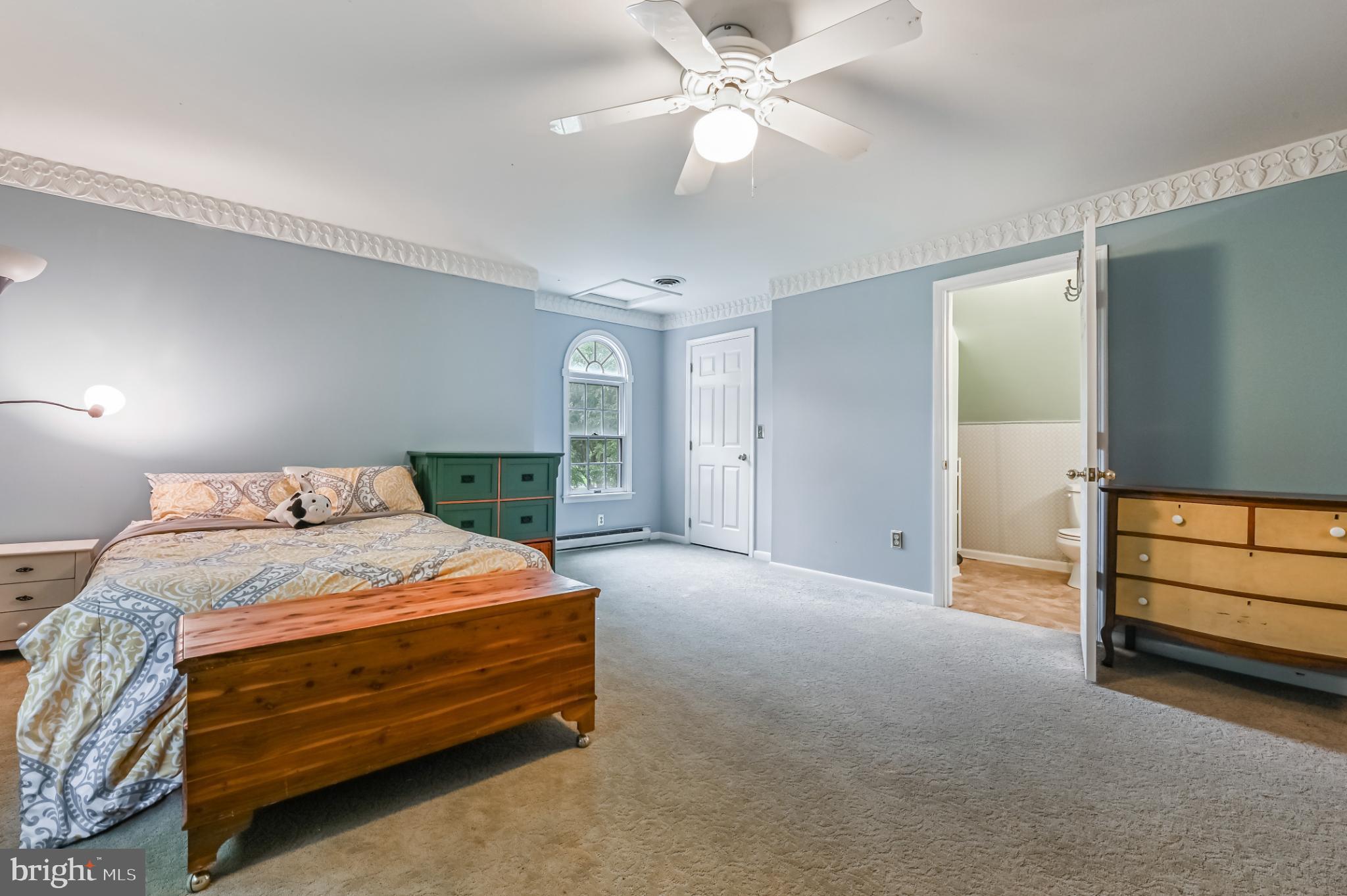 26698 Arcadia Shores Road Easton, MD 21601 - Photo 44 of 71 a bedroom with a bed and a chandelier