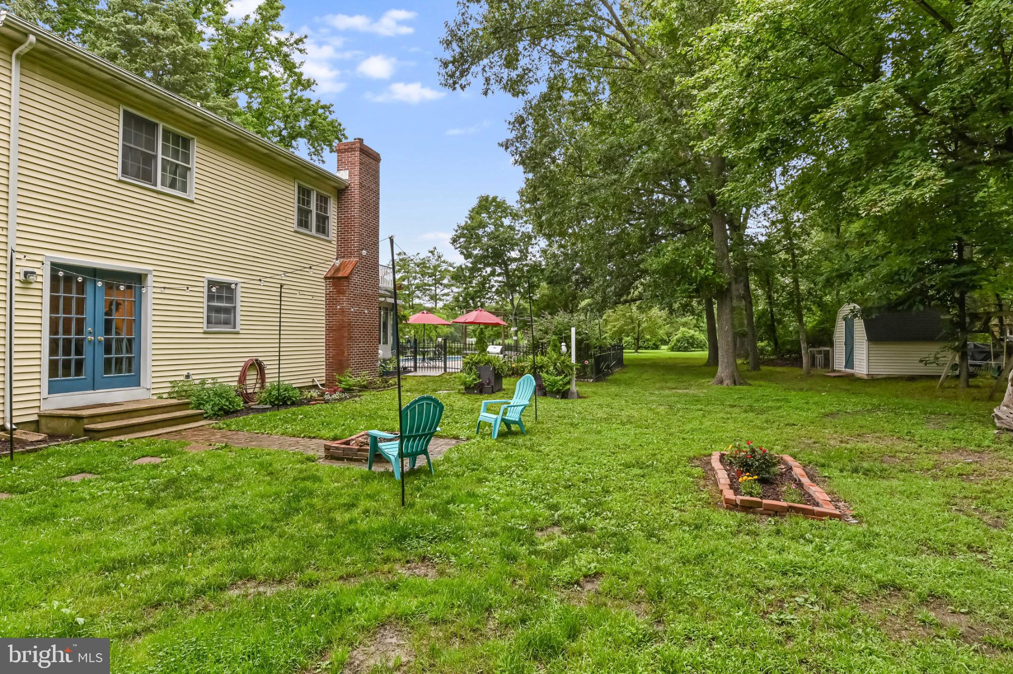 26698 Arcadia Shores Road Easton, MD 21601 - Photo 53 of 71 Serene backyard retreat with lush greenery.
