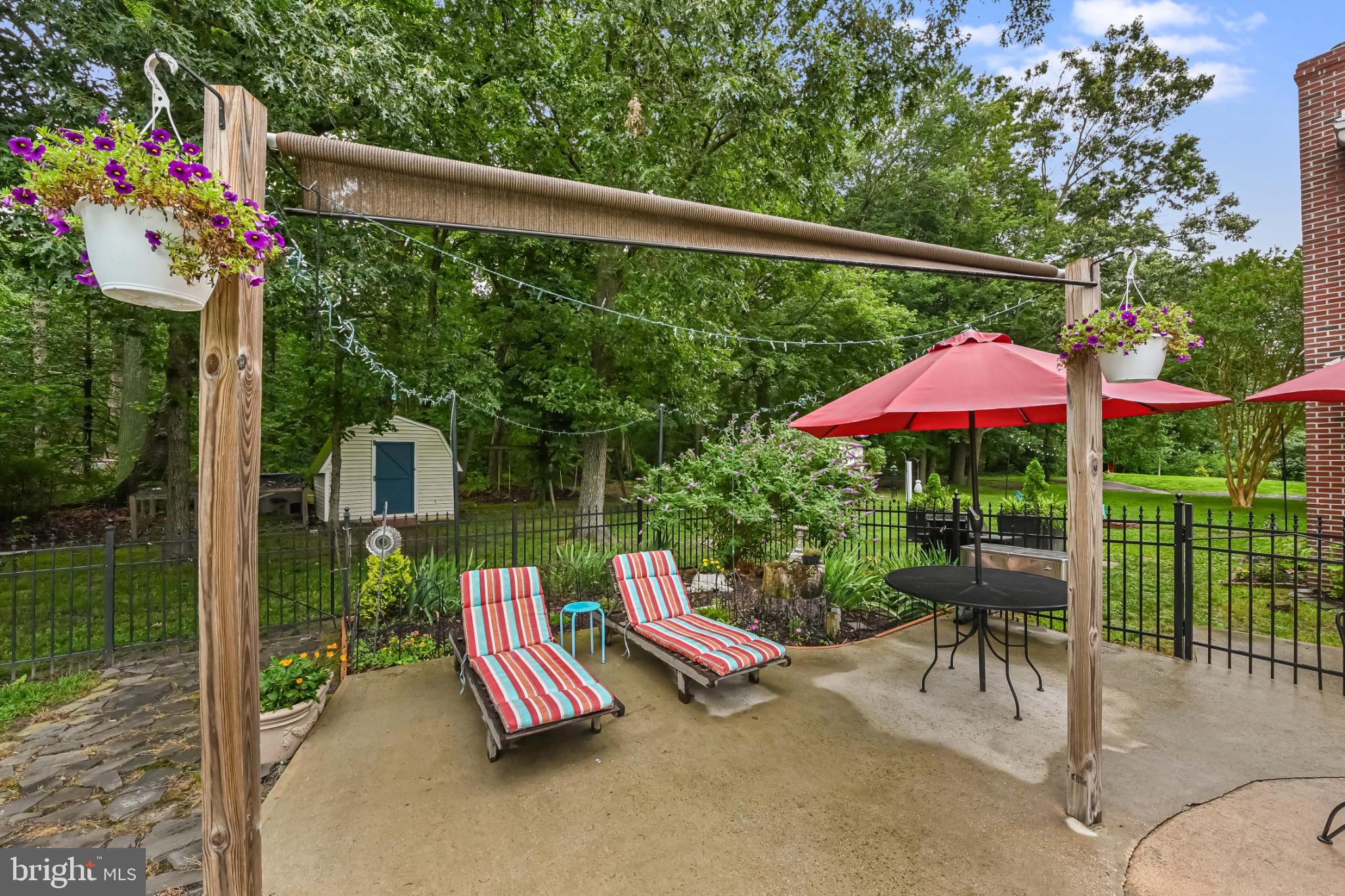 26698 Arcadia Shores Road Easton, MD 21601 - Photo 57 of 71 Charming outdoor retreat with vibrant greenery.