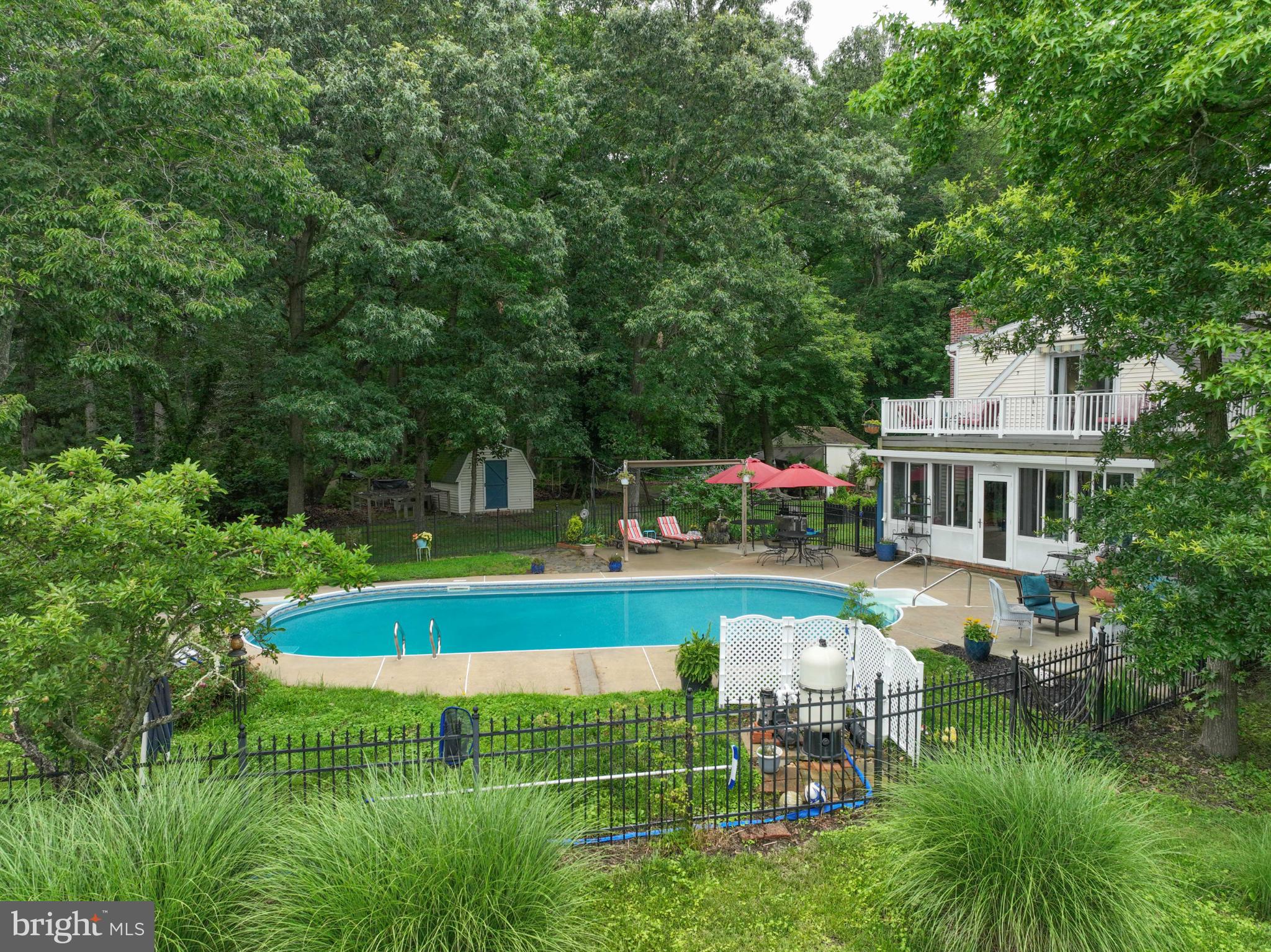 26698 Arcadia Shores Road Easton, MD 21601 - Photo 58 of 71 Serene backyard oasis with inviting pool.