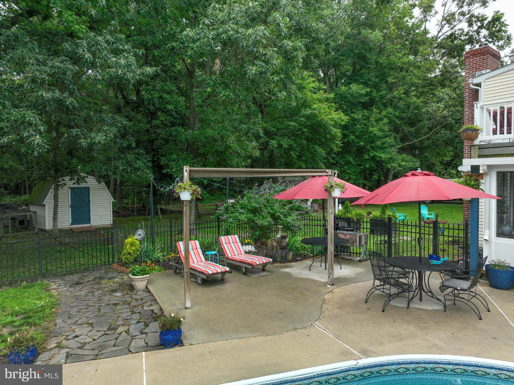 26698 Arcadia Shores Road Easton, MD 21601 - Photo 60 of 71 Tranquil backyard oasis with shaded seating.