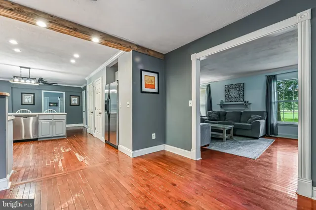 a view of a livingroom with furniture and a flat screen tv