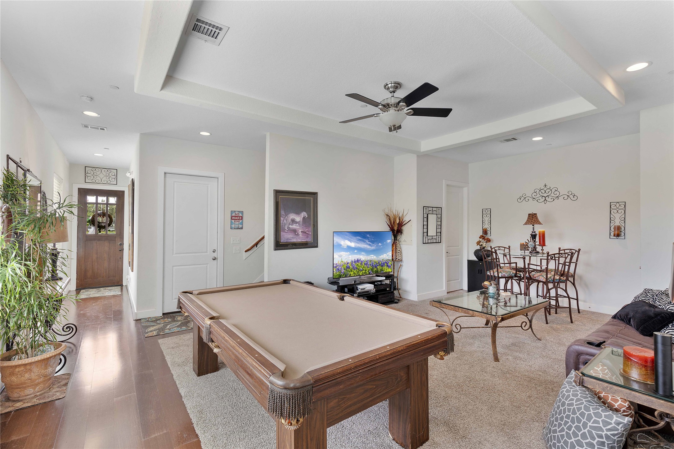 11434 Ketch Court Willis, TX 77318 - Photo 4 of 50 a living room with furniture a dining table and a potted plant