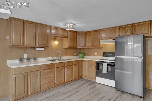 The kitchen has new Luxury Plank Vinyl floors, lighting and refrigerator.