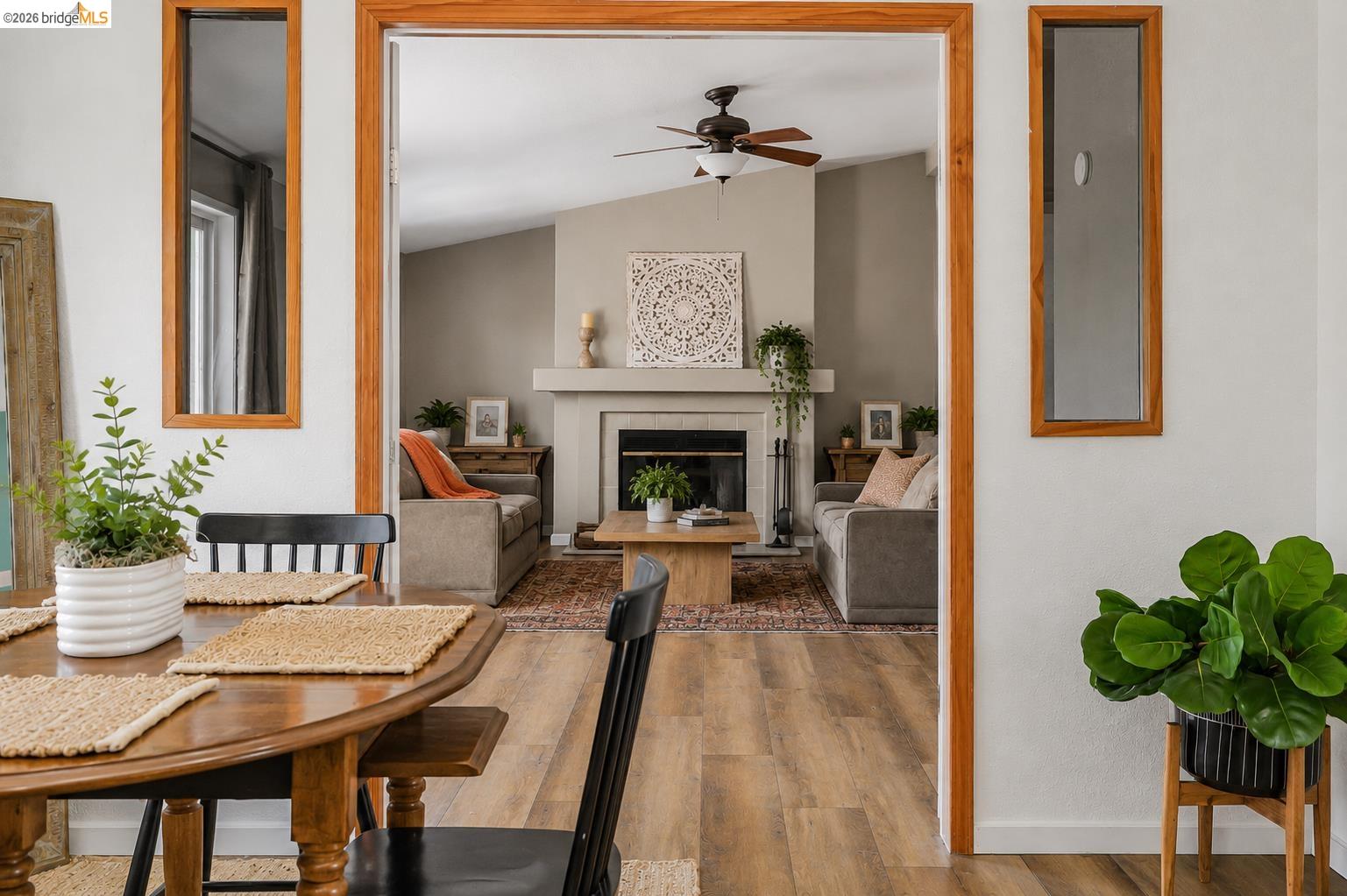 4419 Little John Road Copperopolis, CA 95228 - Photo 8 of 43 Living room with a vaulted ceiling, wood-finish flooring, and a fireplace with a mantel