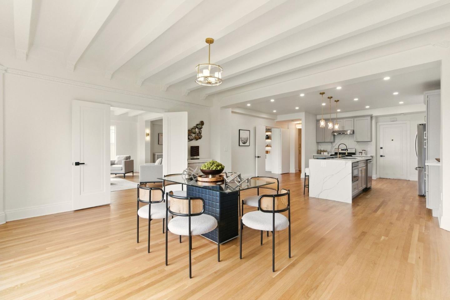 244 Lakeside Drive, Unit 202 Oakland, CA 94612 - Photo 15 of 32 a view of a dining room with furniture and wooden floor
