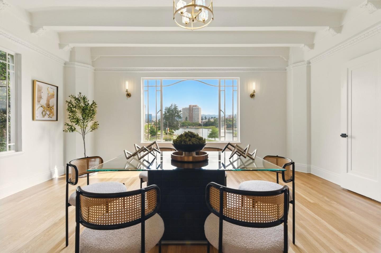 244 Lakeside Drive, Unit 202 Oakland, CA 94612 - Photo 16 of 32 a dining room with furniture and wooden floor
