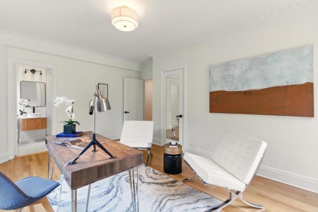 244 Lakeside Drive, Unit 202 Oakland, CA 94612 - Photo 23 of 32 a living room with a couch and a window