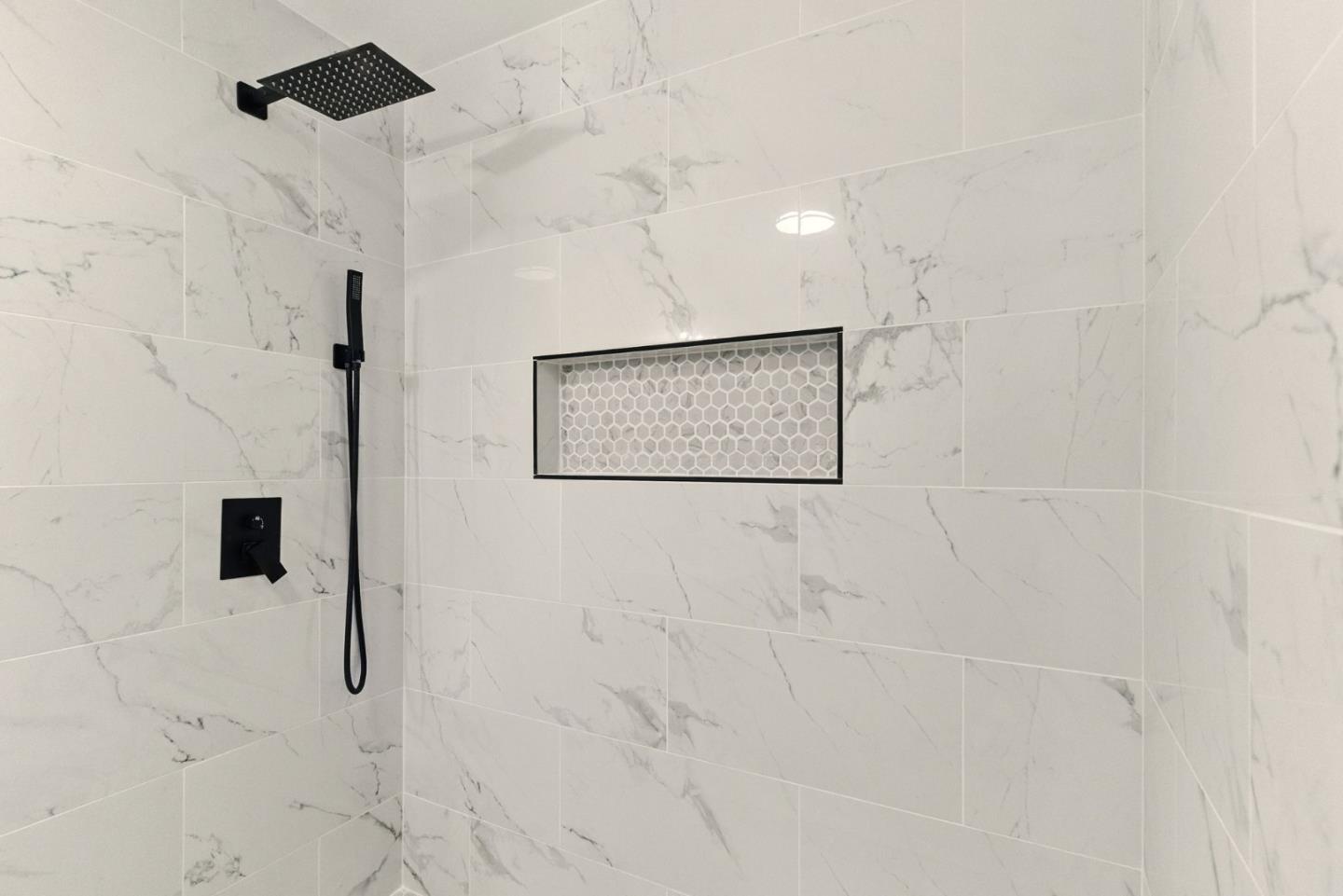 244 Lakeside Drive, Unit 202 Oakland, CA 94612 - Photo 25 of 32 a bathroom with a shower