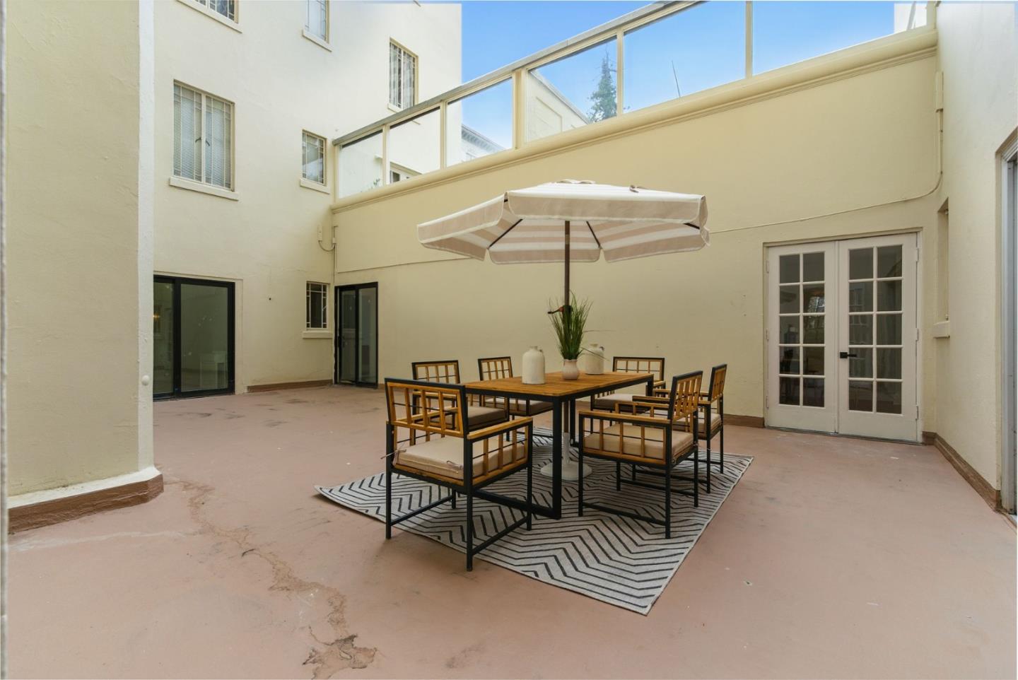 244 Lakeside Drive, Unit 202 Oakland, CA 94612 - Photo 29 of 32 a view of a dining room with furniture and chandelier