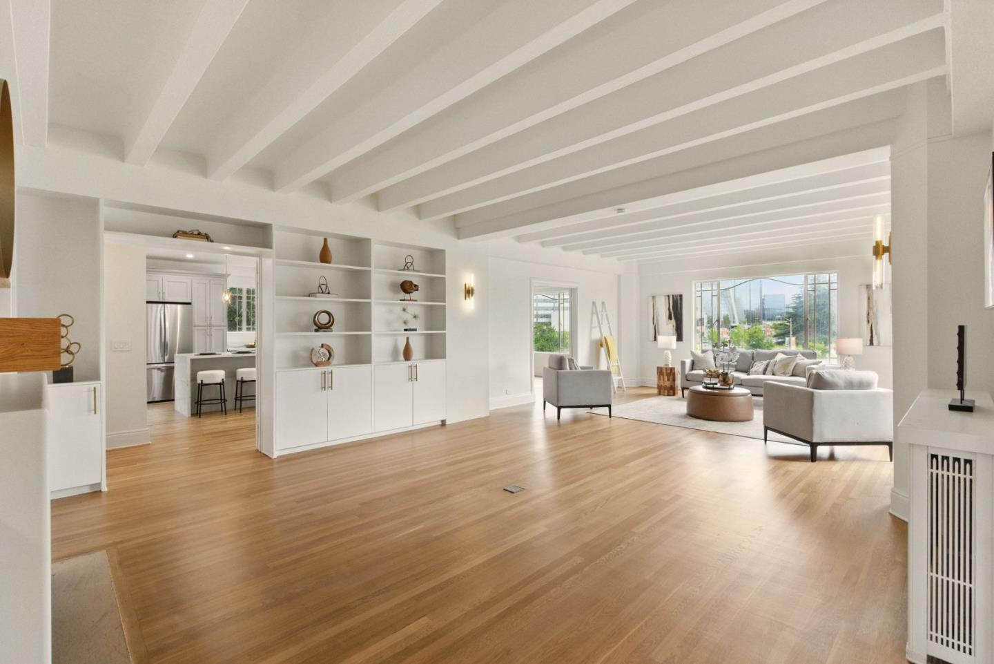 244 Lakeside Drive, Unit 202 Oakland, CA 94612 - Photo 7 of 32 a living room with furniture and wooden floor