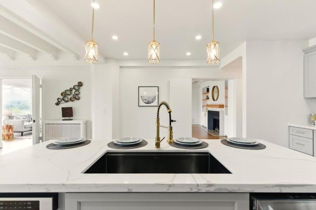244 Lakeside Drive, Unit 202 Oakland, CA 94612 - Photo 8 of 32 a view of counter top with granite countertop cabinets and chandelier