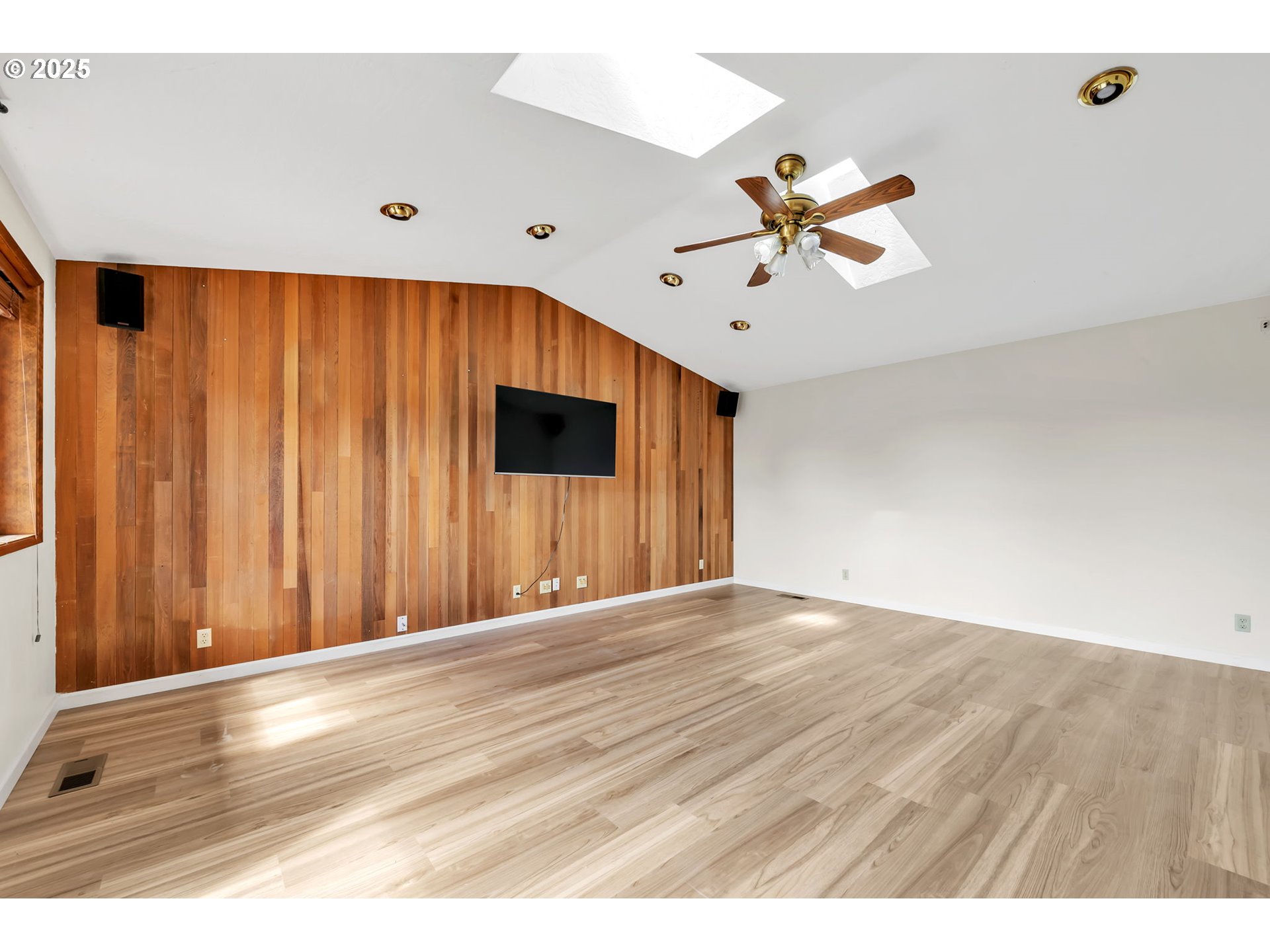 590 Granite Place Springfield, OR 97477 - Photo 6 of 21 a view of an empty room with a ceiling fan