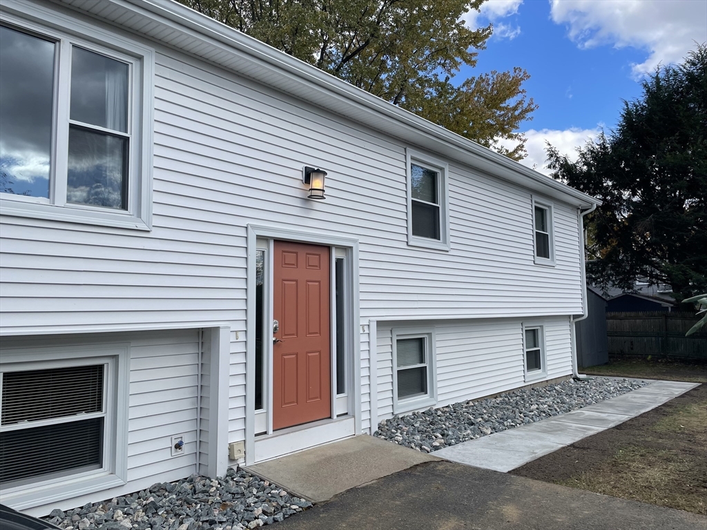 77 Cranston Street, Unit 1 Westfield, MA 01085 - Photo 1 of 11 a front view of a house with a garage