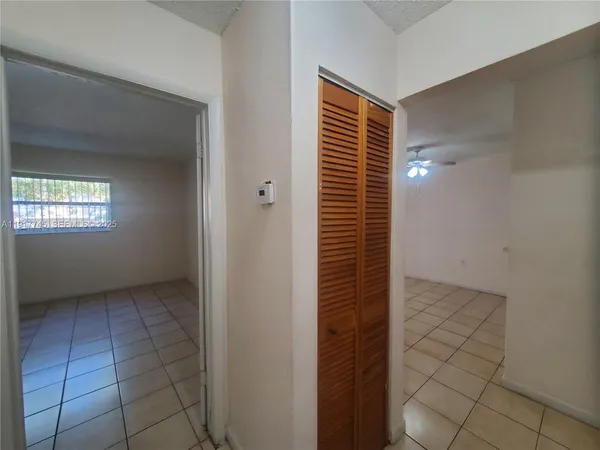 a view of hallway with windows