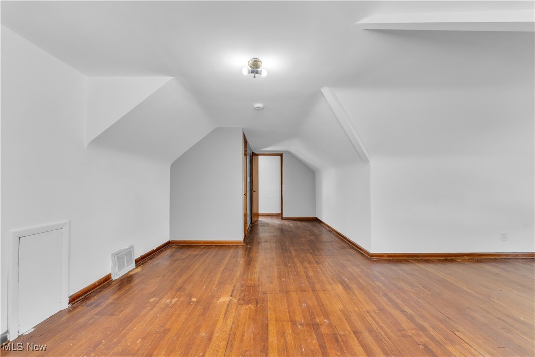 5817 Turney Road Garfield Heights, OH 44125 - Photo 20 of 31 Bonus room with hardwood / wood-style floors and vaulted ceiling