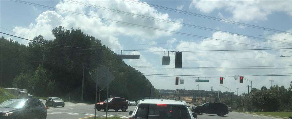 1375 Rock Springs Road Buford, GA 30519 - Photo 7 of 25 a roof deck with table and chairs and potted plants