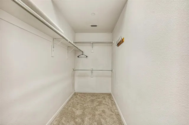 a view of a hallway with windows