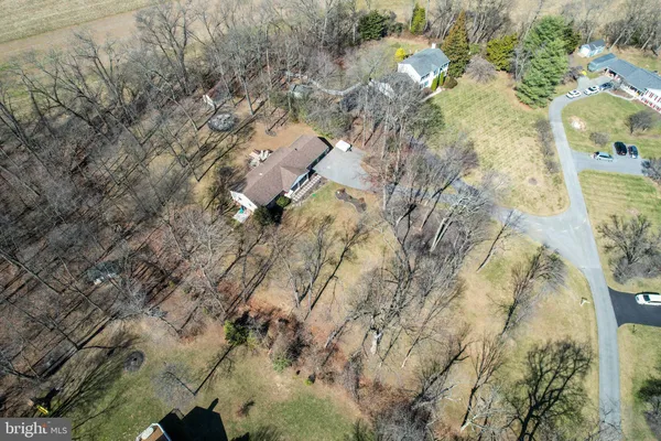 a bedroom with furniture and a large window