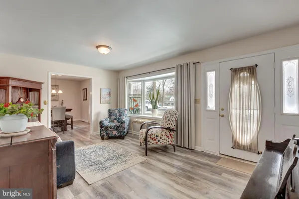 a room with granite countertop furniture and a chandelier