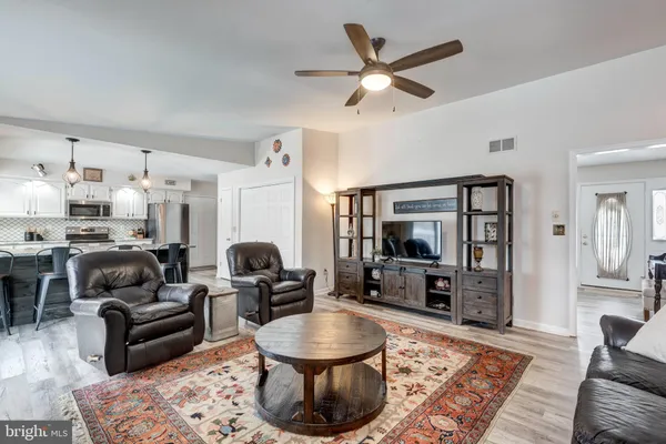 a large kitchen with stainless steel appliances lots of counter top space