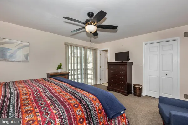 a bedroom with a bed and cabinets