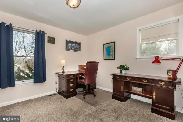 a bedroom with a bed and furniture