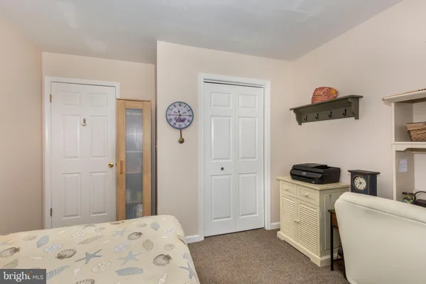 a room with pool table and wooden floor