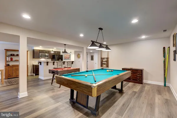 a kitchen with stainless steel appliances a stove a sink and a refrigerator