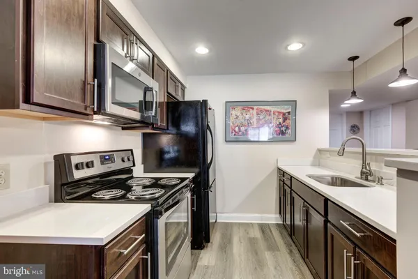 a living room with furniture a flat screen tv and a couch