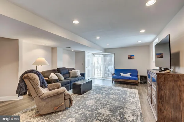 a white toilet sitting next to a shower curtain