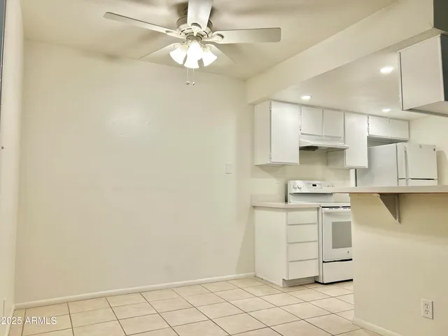 a kitchen with stainless steel appliances cabinets a sink and a stove
