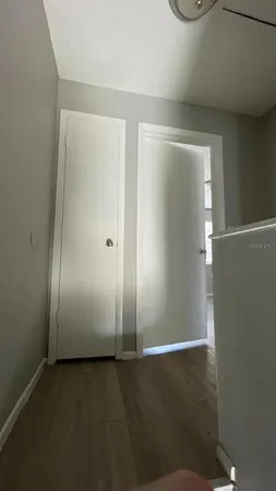 an empty room with wooden floor