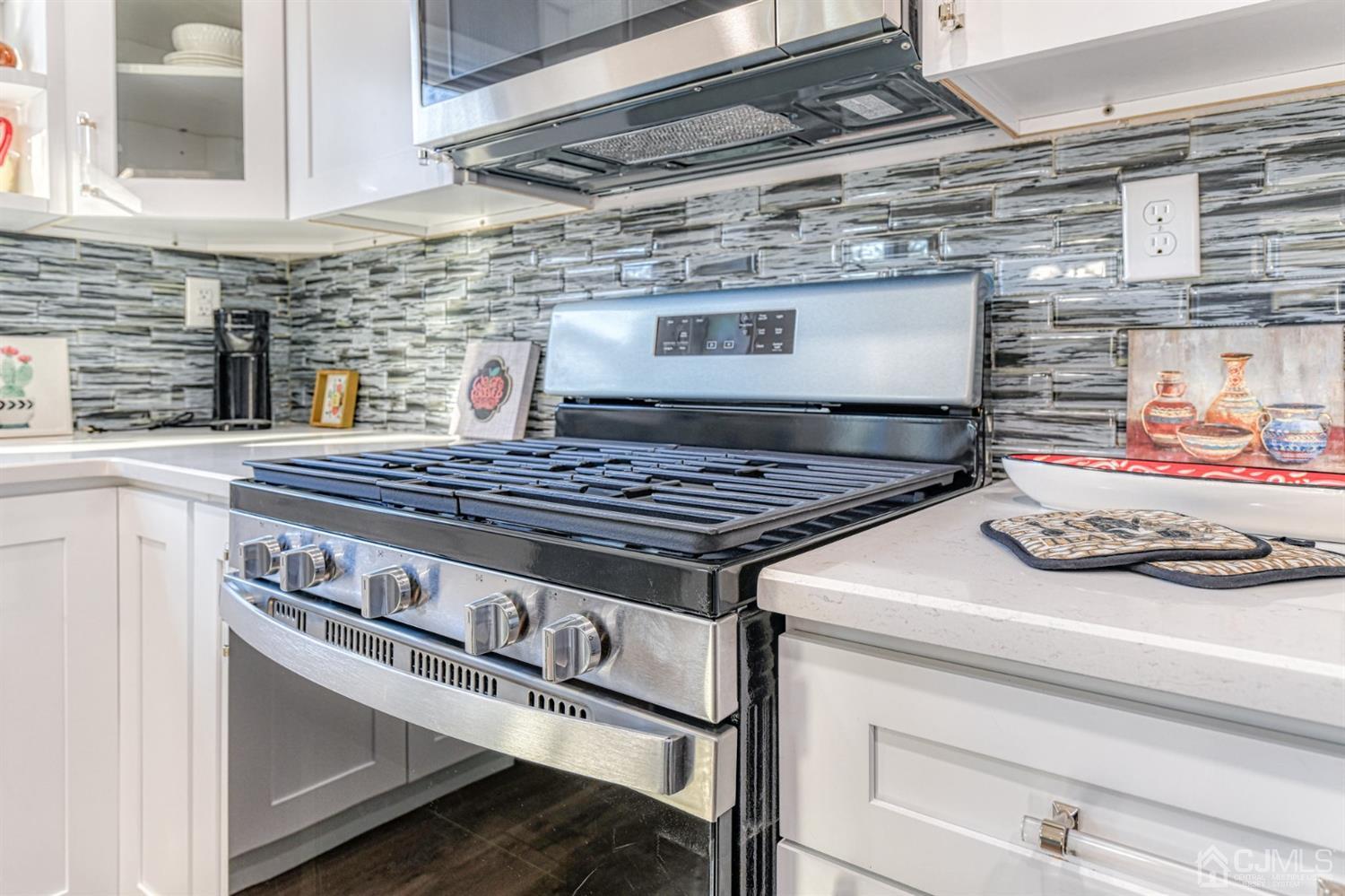 22 Devon Drive Piscataway, NJ 08854 - Photo 12 of 37 a stove top oven sitting inside of a kitchen