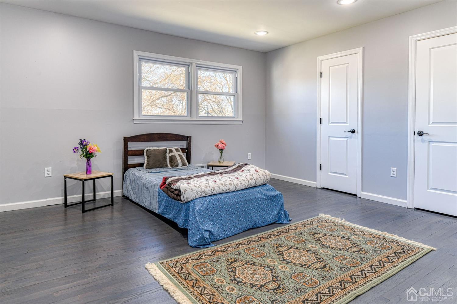 22 Devon Drive Piscataway, NJ 08854 - Photo 25 of 37 a bedroom with a bed and wooden floor