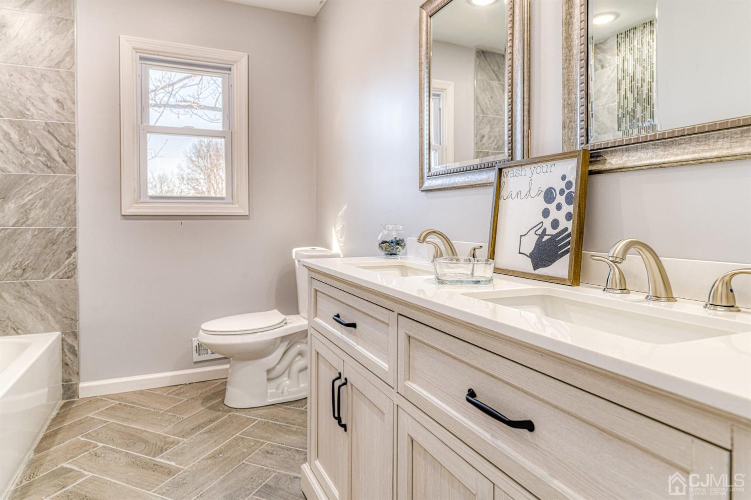 22 Devon Drive Piscataway, NJ 08854 - Photo 26 of 37 a bathroom with a toilet a sink and mirror
