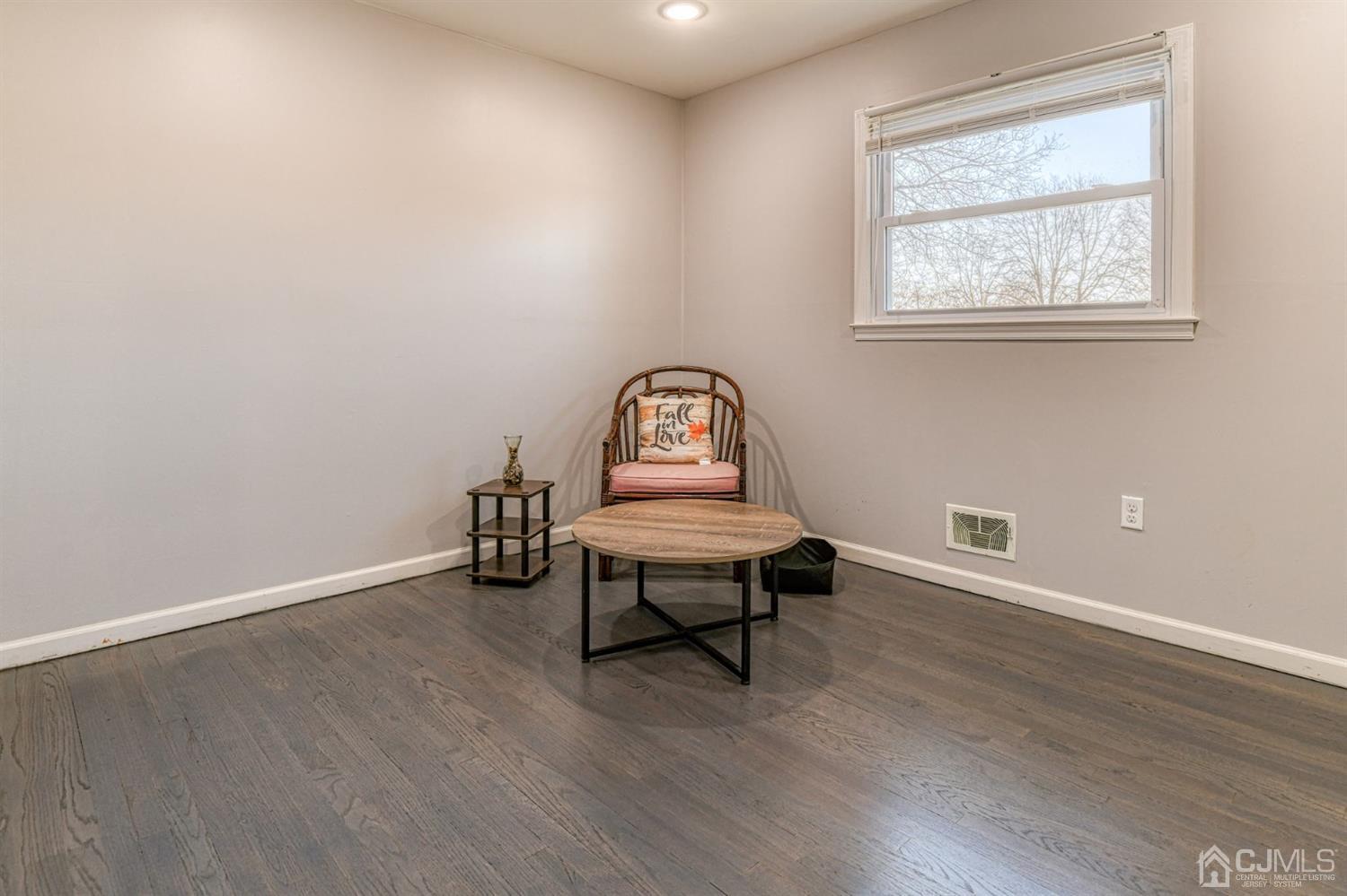 22 Devon Drive Piscataway, NJ 08854 - Photo 29 of 37 a view of a room with wooden floor lounge chair and windows
