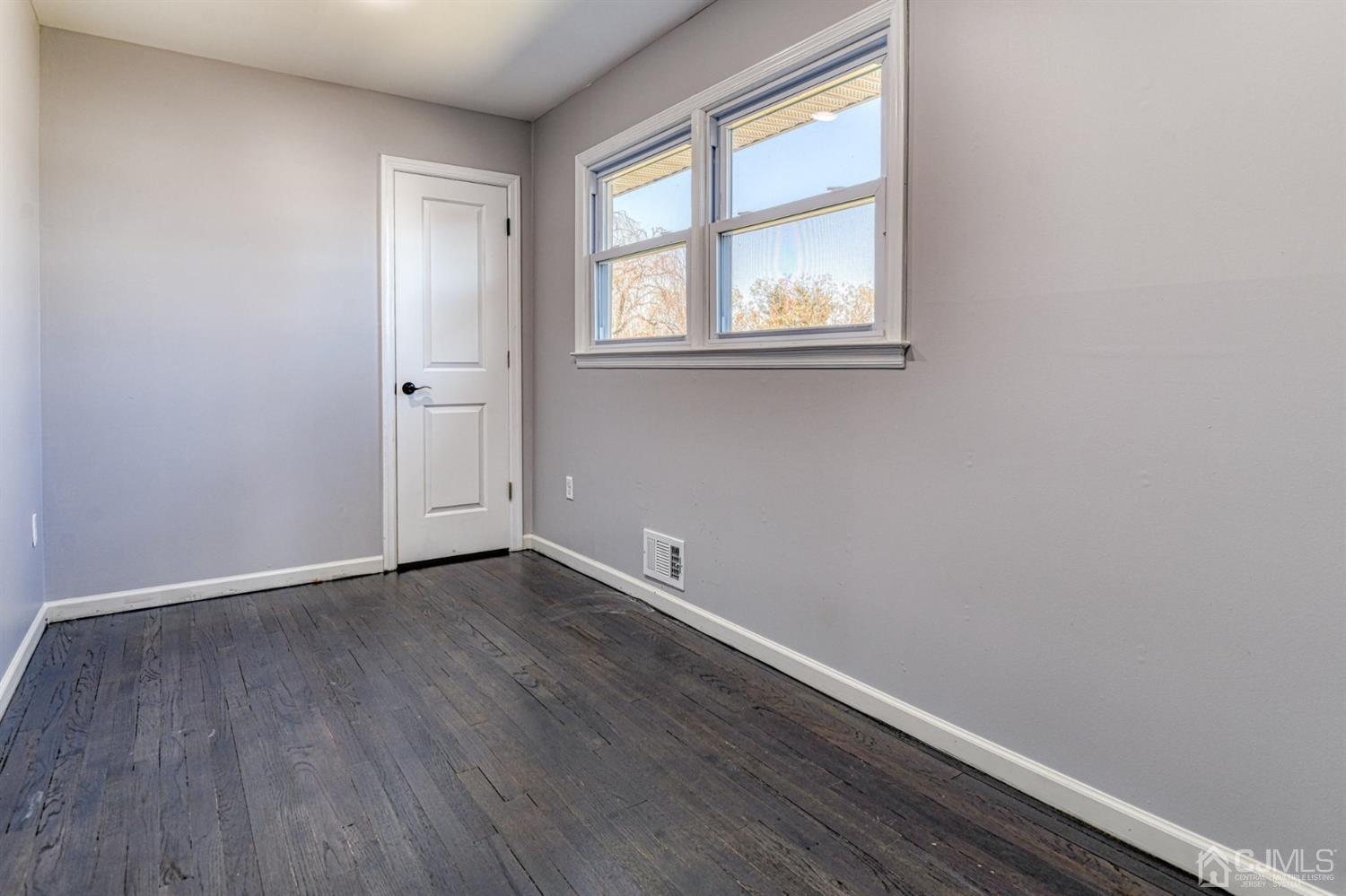 22 Devon Drive Piscataway, NJ 08854 - Photo 30 of 37 an empty room with wooden floor and windows