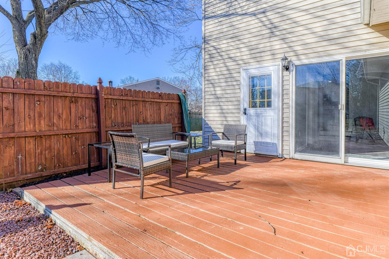 22 Devon Drive Piscataway, NJ 08854 - Photo 37 of 37 a view of a terrace with furniture and wooden floor