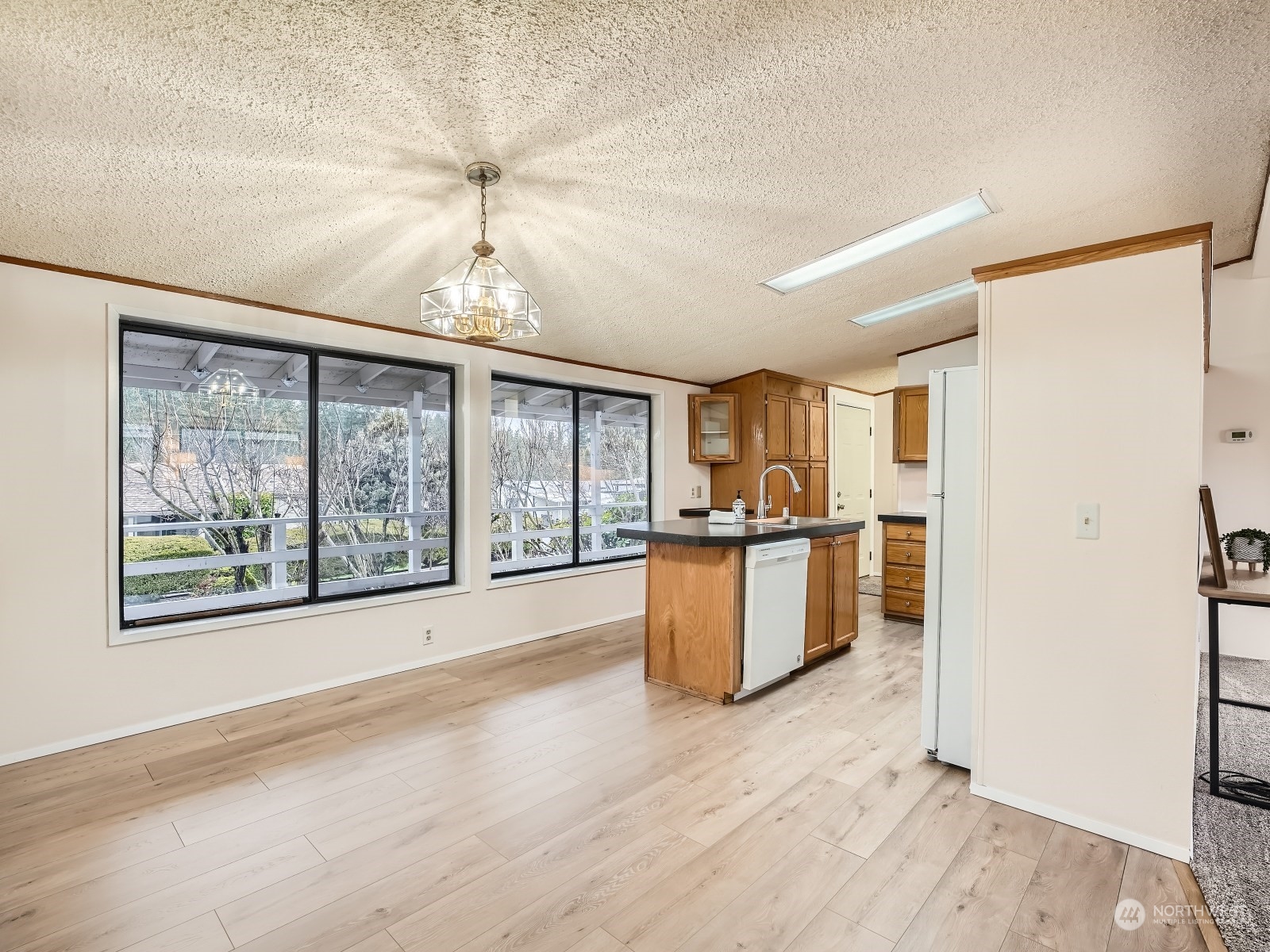 2505 South 371st Street, Unit 37 Federal Way, WA 98003 - Photo 19 of 27 a view of a kitchen with a sink and a large window