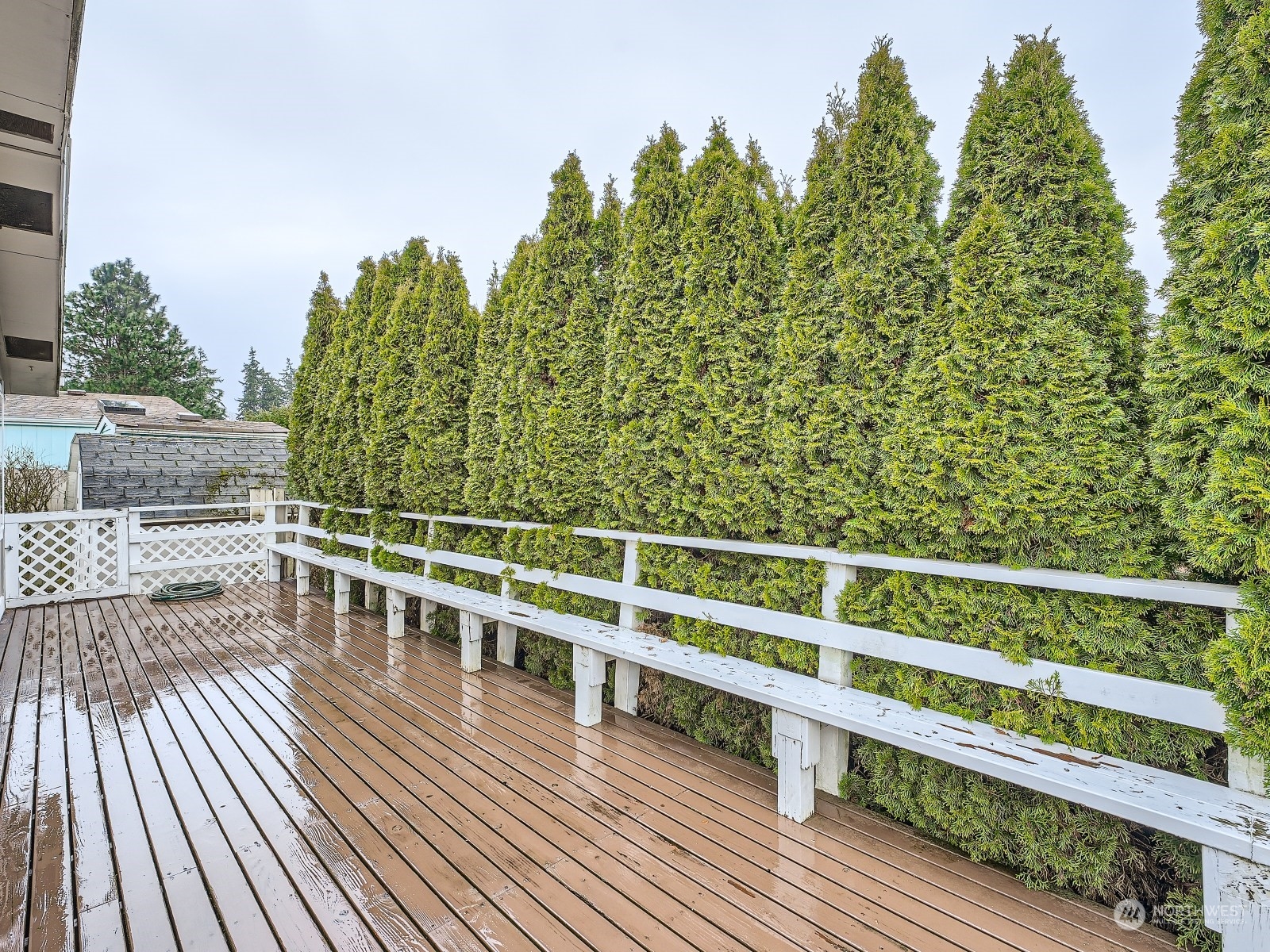 2505 South 371st Street, Unit 37 Federal Way, WA 98003 - Photo 21 of 27 a view of balcony with wooden floor and fence