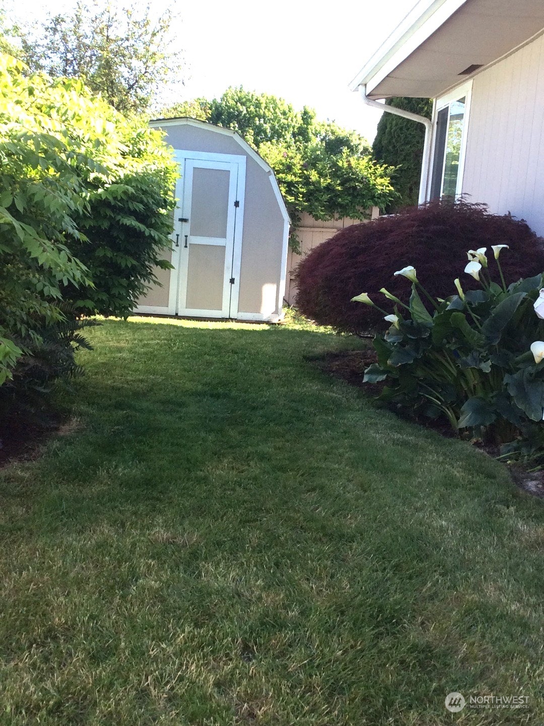 2505 South 371st Street, Unit 37 Federal Way, WA 98003 - Photo 25 of 27 a view of house with a yard